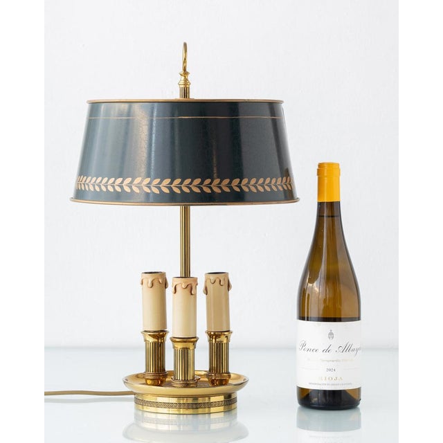 Elegant French Empire-style bouillotte lamp with polished brass base, three candle lights, and teal crackle-finish metal...