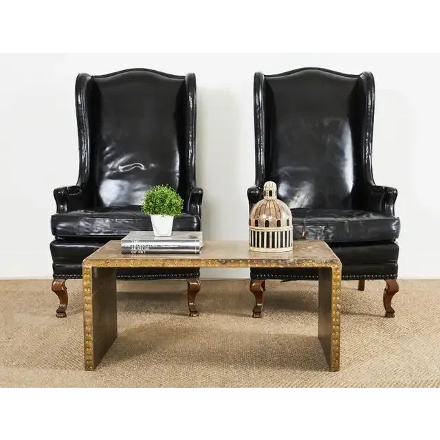 Amazing Mid-Century Modern brass waterfall coffee or cocktail table by Sarreid Ltd. The table features a patchwork of...