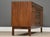 A mid century modern walnut sideboard credenza with two doors and six drawers designed by Edward Wormley for Dunbar....
