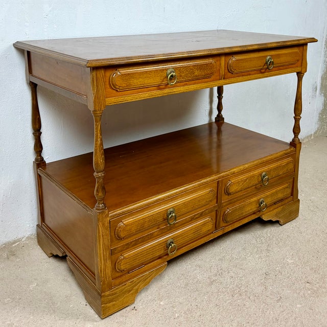 Spanish sideboard dating from the 1980s. Crafted in wood, it features a spacious rectangular top above two drawers, an...
