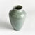 In a modern silhouette with a subtle linenlike texture, reactive glaze and high gloss finish, this ceramic vase is a...