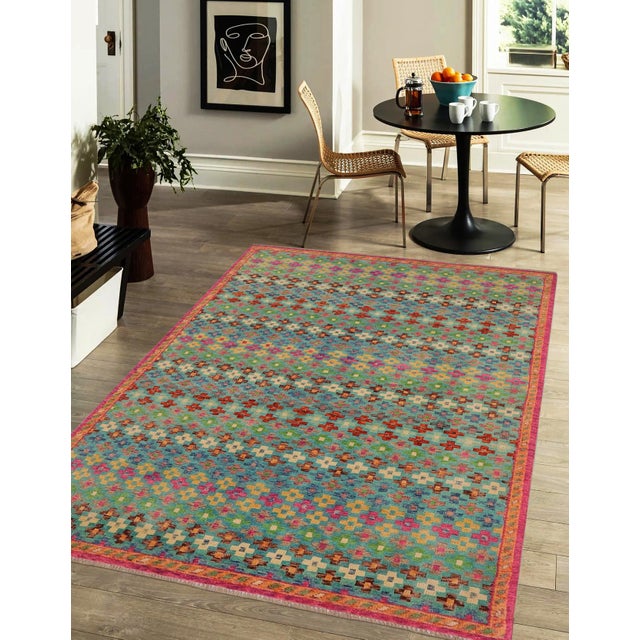 This stunning hand-knotted Afghan Balouchi rug is a captivating addition to any decor. Crafted by skilled artisans, it...