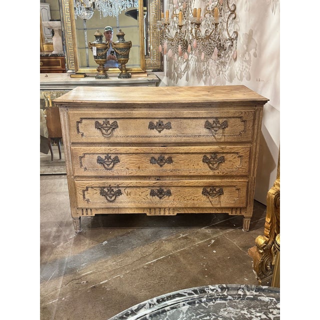 The product is an 18th c. French Louis XVI Bleached Oak Chest, perfect for a bedroom or living room. It features an...