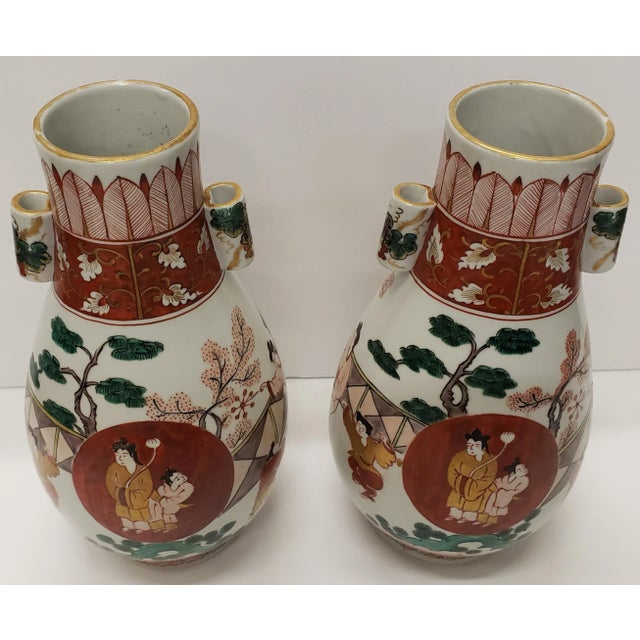 Up for sale is a air of Circa 1960 Japanese Kutani Style Porcelain Auspicious Motifs Arrow Vases (Showa Period)! They each...