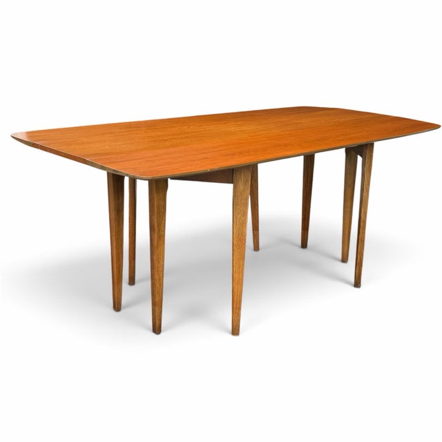Designed by John Van Koert for Drexel’s Profile collection, this 1957 K43 dining table pairs sculptural mid-century form...