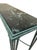Elegant wrought iron console table featuring a richly veined green marble top. The slender iron frame showcases classic...