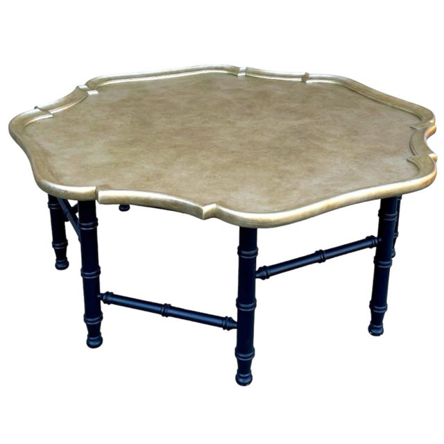This is a large scale Chinese Chippendale style coffee table in the manner of Kittinger. The top is gold, and the back is...