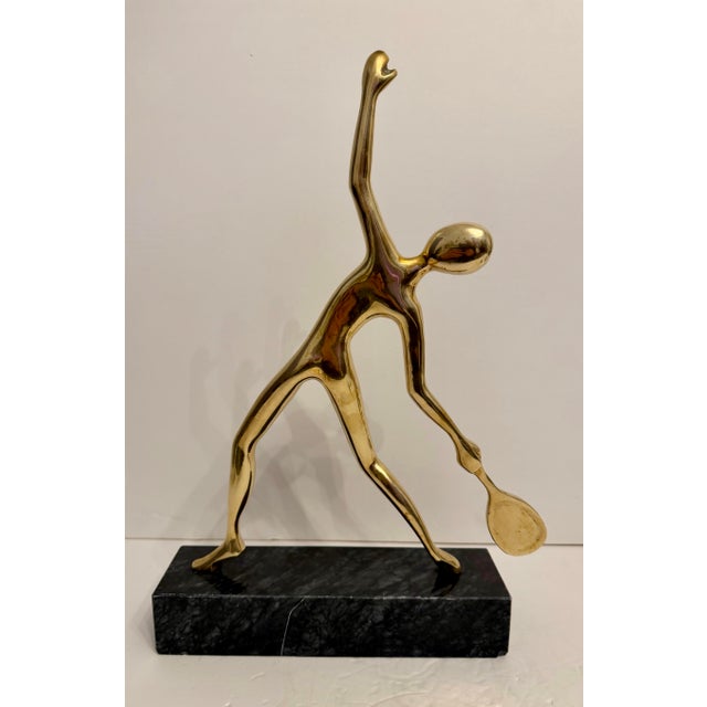 Very unique large heavy solid brass tennis sculpture or statue on grey and black marble base. Great abstract Mid Century...