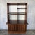 A striking 1960s teak bureau bookcase by A Younger, combining open display shelving, a concealed writing desk and lower...