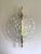 Impressive Italian Fashion Wall Light in Transparent Murano Glass Disc and Brass Metal Frame by Simoeng Murano glass disc...