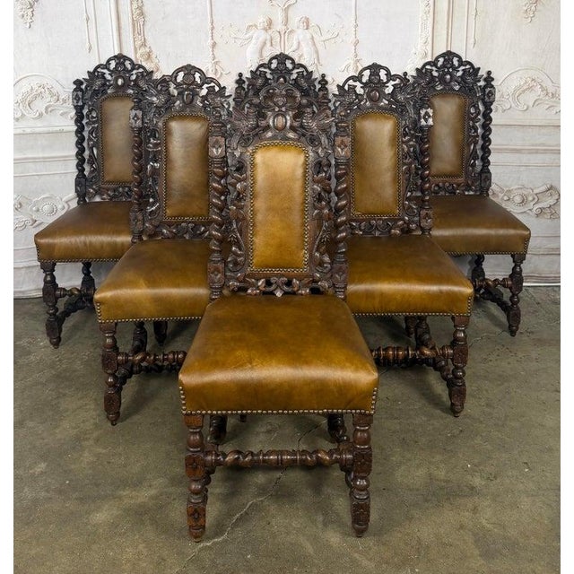 A magnificent and rare set of six Jacobean Revival hunt dining chairs, a true celebration of 19th-century master...