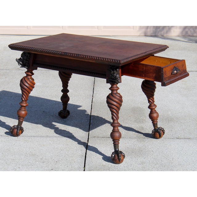 Exceptional and rare antique Renaissance Revival writing table or library desk, crafted from solid oak and richly detailed...