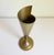 A conical vase with a unique asymmetrical spiral design. Made of solid brass with a wonderful natural patina. A rare find!