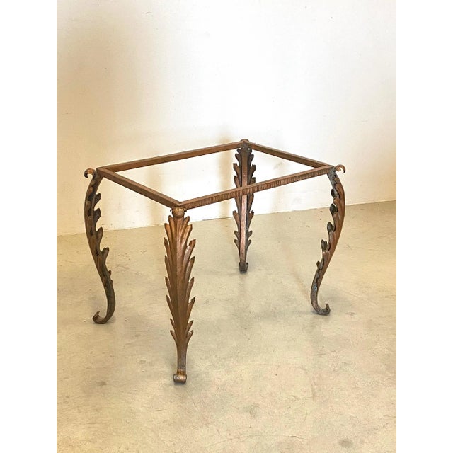 Cristal Art coffee table 50's, iron structure lacquered copper color, cut and engraved glass top painted in the same...
