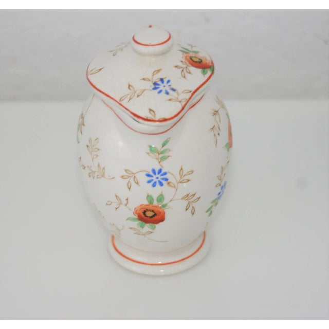 Vintage Ceramic Floral Design Lidded Syrup Pitcher Orange, Yellow, & Blue Floral Pattern This is a lovely dainty pitcher...