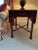 This pair of mahogany X-stretcher drop-leaf tables by Southampton USA is a stunning addition to any room. The antique...