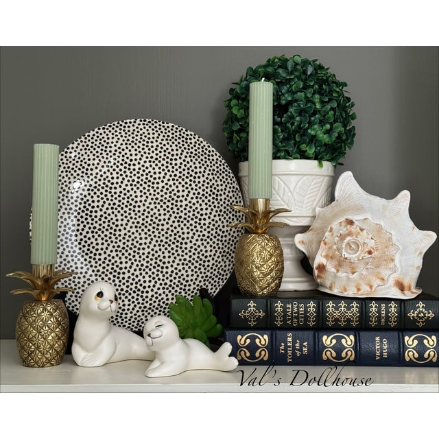 Vintage items are the way to add unique soul to your space and here is a perfect example. Presenting a pair of white...
