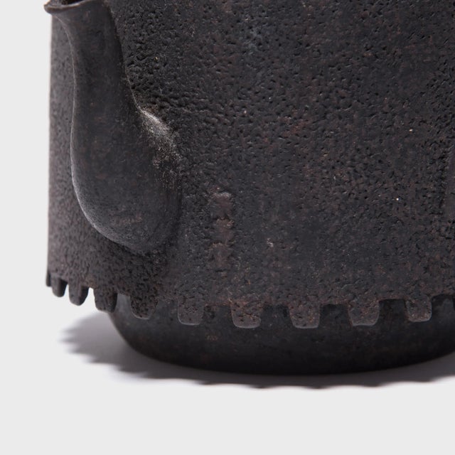 Decorated with a raised fan motif, this aptly named teapot was used to boil water for traditional tea ceremonies. The...