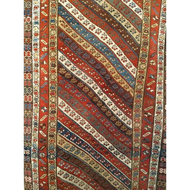 This exceptional 19th-century Caucasian Gendje Kazak runner is a vivid expression of village weaving traditions from the...