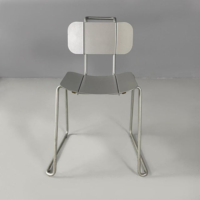 Italian modern aluminum chairs by Tanzi, 1980s Set of four chairs with rectangular base, entirely in aluminum. The seat...