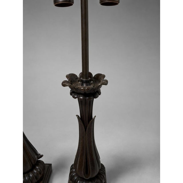 An imposing pair of Grand Tour–style table lamps, conceived in the Neoclassical taste and combining richly patinated...