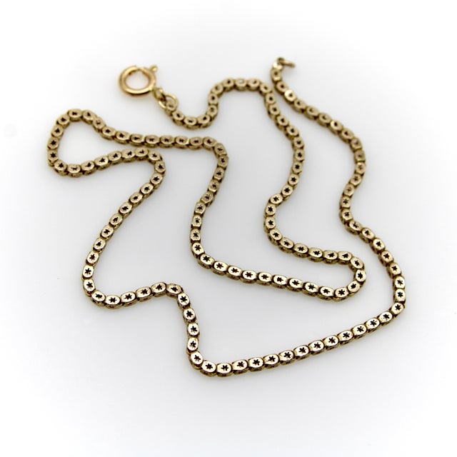 This early Victorian star link chain is a rare, hard-to-find treasure. Rendered in 10k gold, the chain consists of square...