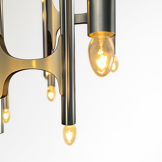 This rare 1970s Gaetano Sciolari chrome chandelier for Lightolier is a standout example of Mid-Century Modern, Italian...