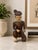 Hand-carved Chinese wooden figural sculpture depicting a seated musician holding a tambourine-style percussion instrument....