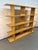 Stylish modern open shelving unit with a clean, minimalist design and beautiful natural wood finish. Features multiple...
