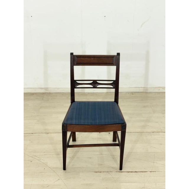 Four beautiful vintage dining chairs in classic English design are for sale. They are sold as a set. The chairs impress...