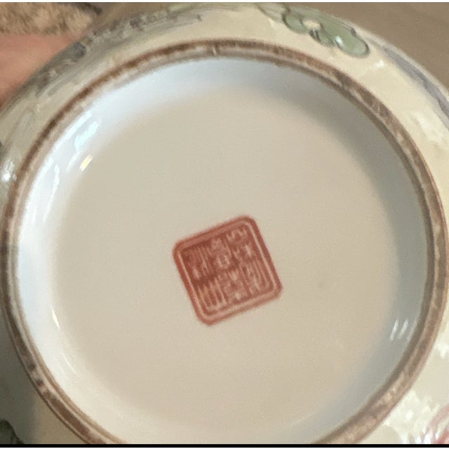 This red stamp is an apocryphal Jiaqing reign mark (大清嘉慶年製 - Da Qing Jiaqing Nian Zhi), which translates to "Great Qing,...