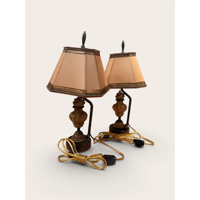 Pair of miniature 19th century French bronze flame and urn fragment lamps. Each features an urn-form bronze body raised on...