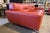 This striking Roche Bobois red-orange leather sofa is a bold expression of modern European design, blending sculptural...