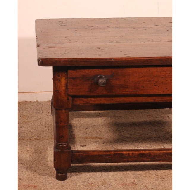 Exquisite Spanish Renaissance-era walnut coffee table from the late 16th century. This rare coffee table features a...