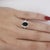 2.0 Carat Oval Cut Blue Sapphire & 0.58 Carat Round Diamond Halo Setting Statement Ring in size 6.5 Details: Item Type:...