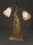This Art Deco table lamp features a sculptural female figure by renowned artist Georges Van De Voorde. The statue, signed...