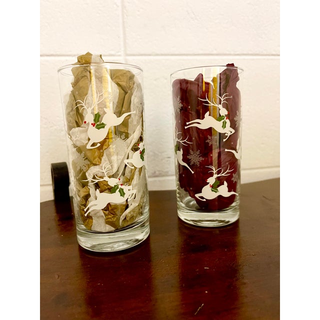 “Leaping Reindeer” by Libbey highball glasses perfect for your holiday parties. The design has white leaping reindeer with...
