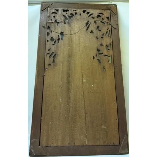 An intricately chiseled Balinese architectural wood relief carving depicting a multi-figure narrative scene alongside...