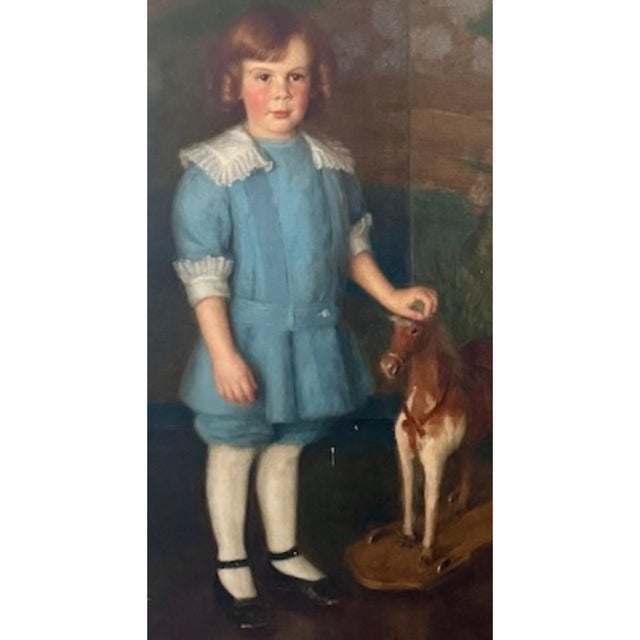 A beautifully composed circa 1900 oil on canvas portrait by American artist Adele Herter, capturing a young child in a...