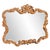 The Talida Mirror is a lovely piece featuring an ornate, textured frame adorned with decorative flourishes. The entire...