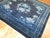 A vintage Chinese square rug in predominant shades of midnight blue. The wool is very soft and all the colors are natural....