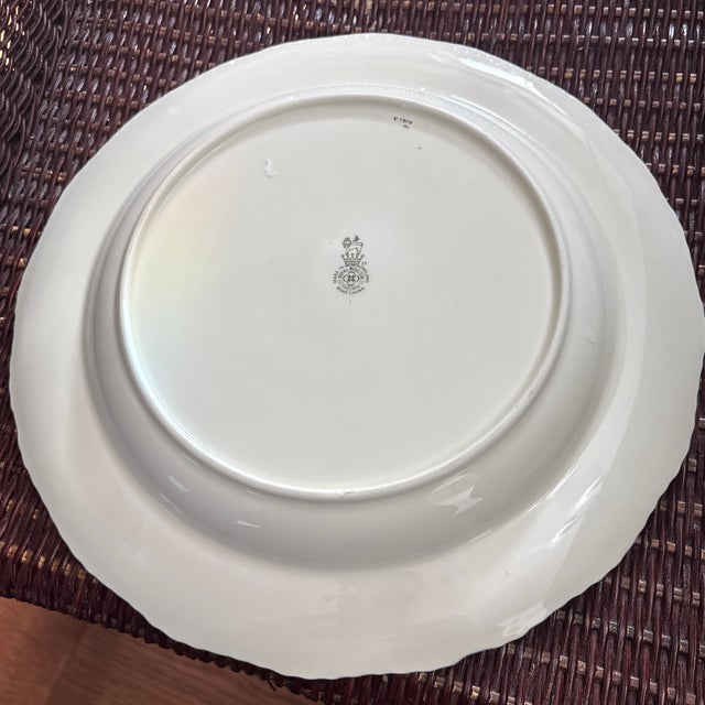 This is a beautiful plate with a large pink cabbage roses with pretty flowers on a cream background with a lovely rich...