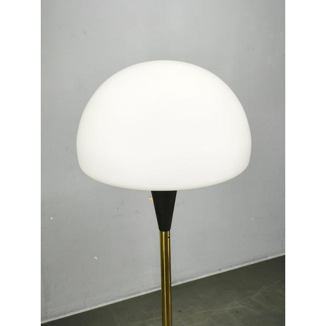 Original Mid-Century Modern floor lamp by Lidokov, manufactured in Czechoslovakia during the 1960s. The lamp features a...