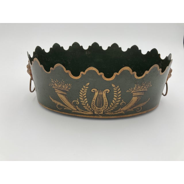 This unique Italian made metal cachepot with lions head handles will look amazing with a floral arrangement or plants...