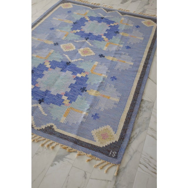 Gorgeous Vintage Blue Rug in a design called 'Carnation" by Ingegerd Silow, Sweden, circa 1950s. A variation of blue...