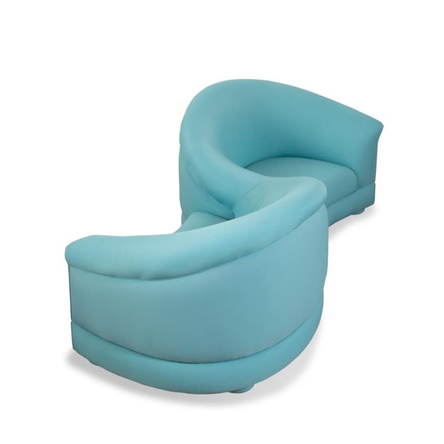 An iconic futurist sofa produced by arpex in the 1970s, famous for its sinuous s-shape, designed to allow two people to...