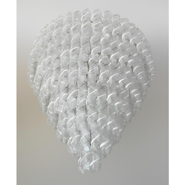 Italian chandelier with clear and white stripe Murano glasses hand blown to produce elegant swirls, mounted on chrome...
