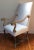 Nice large high back arm chair with older painted finish. The white cotton fabric is only pre upholstery fabric...this...