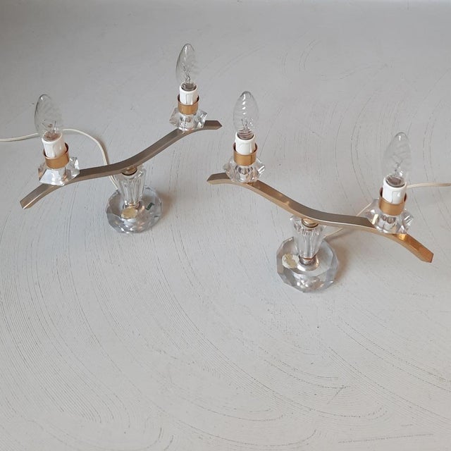 These 2 candelabra lamps were produced in France. Crystal combined with brass. The brass colour has worn off somewhat,...