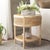 Introducing the Arvid Round Accent Table, exquisitely crafted from the Wood and Rattan materials. A perfect blend of...
